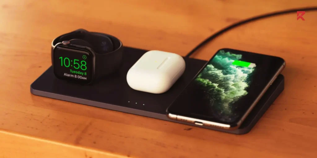 A wireless pad charger on which one apple watch, one airpod set and one iPhone is connected.